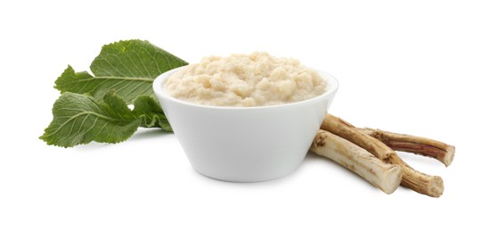 Photo of Tasty horseradish sauce in bowl, roots and leaves isolated on white