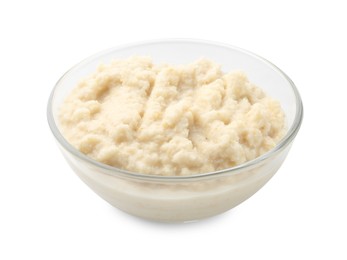 Photo of Tasty horseradish sauce in glass bowl isolated on white