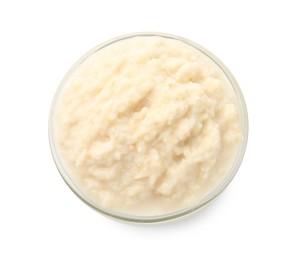 Photo of Tasty horseradish sauce in bowl isolated on white, top view