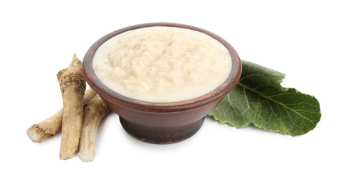 Photo of Tasty horseradish sauce in bowl, roots and leaf isolated on white