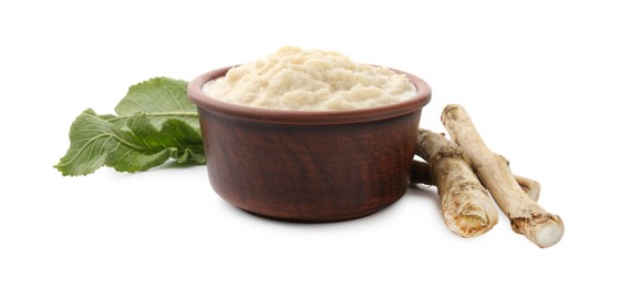 Photo of Tasty horseradish sauce in bowl, roots and leaves isolated on white