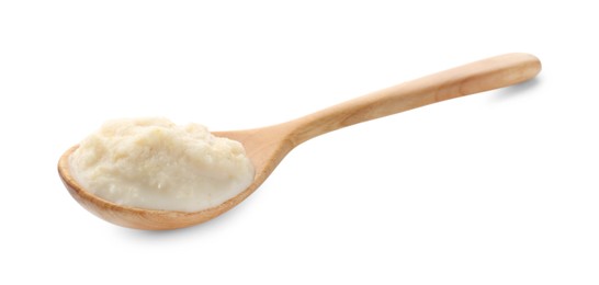Photo of Tasty horseradish sauce in spoon isolated on white