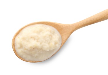 Photo of Tasty horseradish sauce in spoon isolated on white, top view