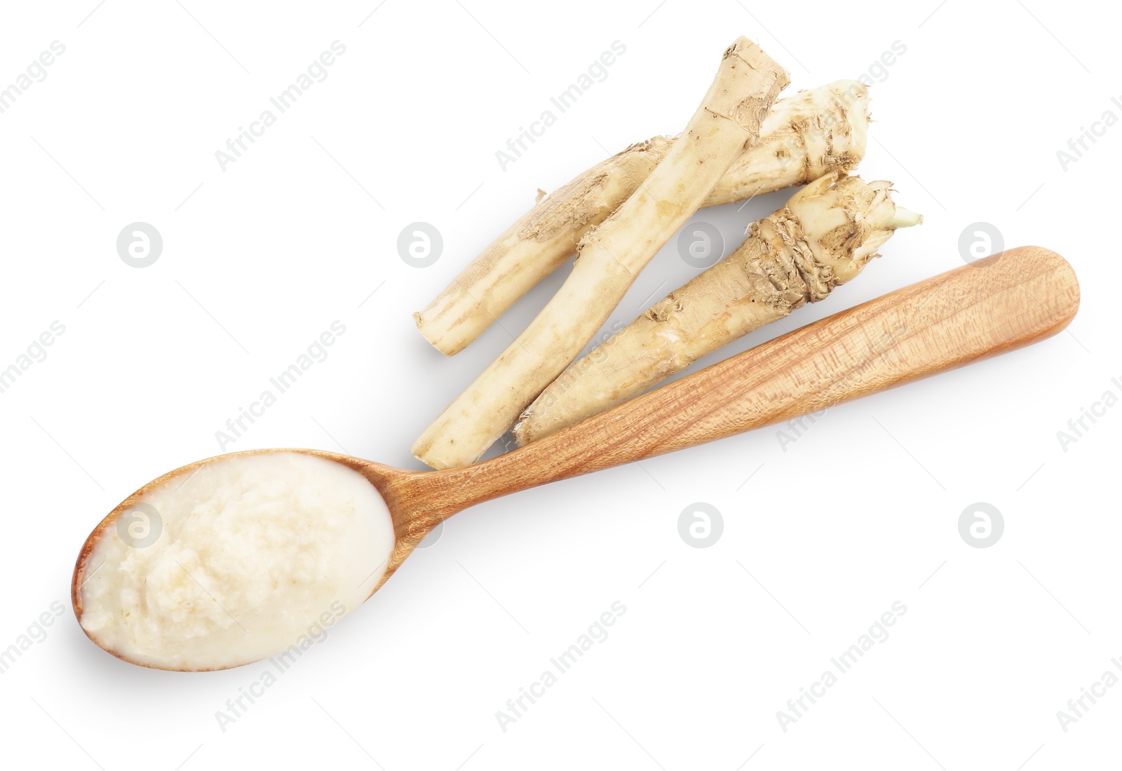 Photo of Tasty horseradish sauce in spoon and roots isolated on white, top view