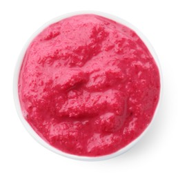 Photo of Tasty horseradish sauce with beetroot in bowl isolated on white, top view
