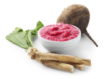 Photo of Tasty horseradish sauce in bowl, beetroot, leaves and roots isolated on white
