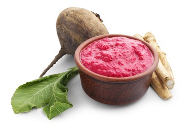 Photo of Tasty horseradish sauce in bowl, beetroot, leaves and roots isolated on white