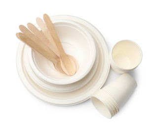 Photo of Set of disposable tableware isolated on white, top view