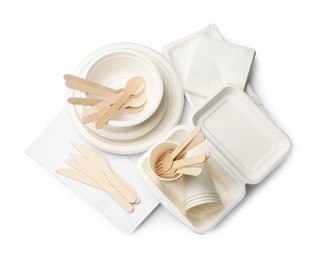 Photo of Set of disposable tableware isolated on white, top view