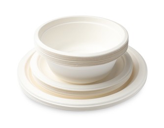 Photo of Set of disposable bowls and plates isolated on white