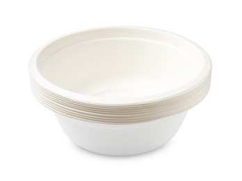 Photo of Set of disposable bowls isolated on white