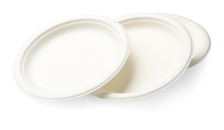Photo of Set of disposable plates isolated on white
