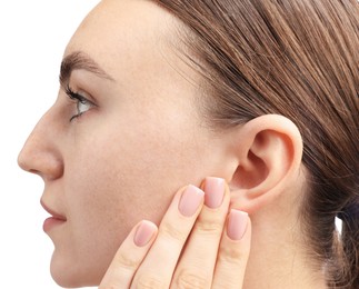 Photo of Sound. Woman touching his ear on white background, closeup