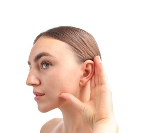 Photo of Sound. Woman showing hand to ear gesture on white background, closeup