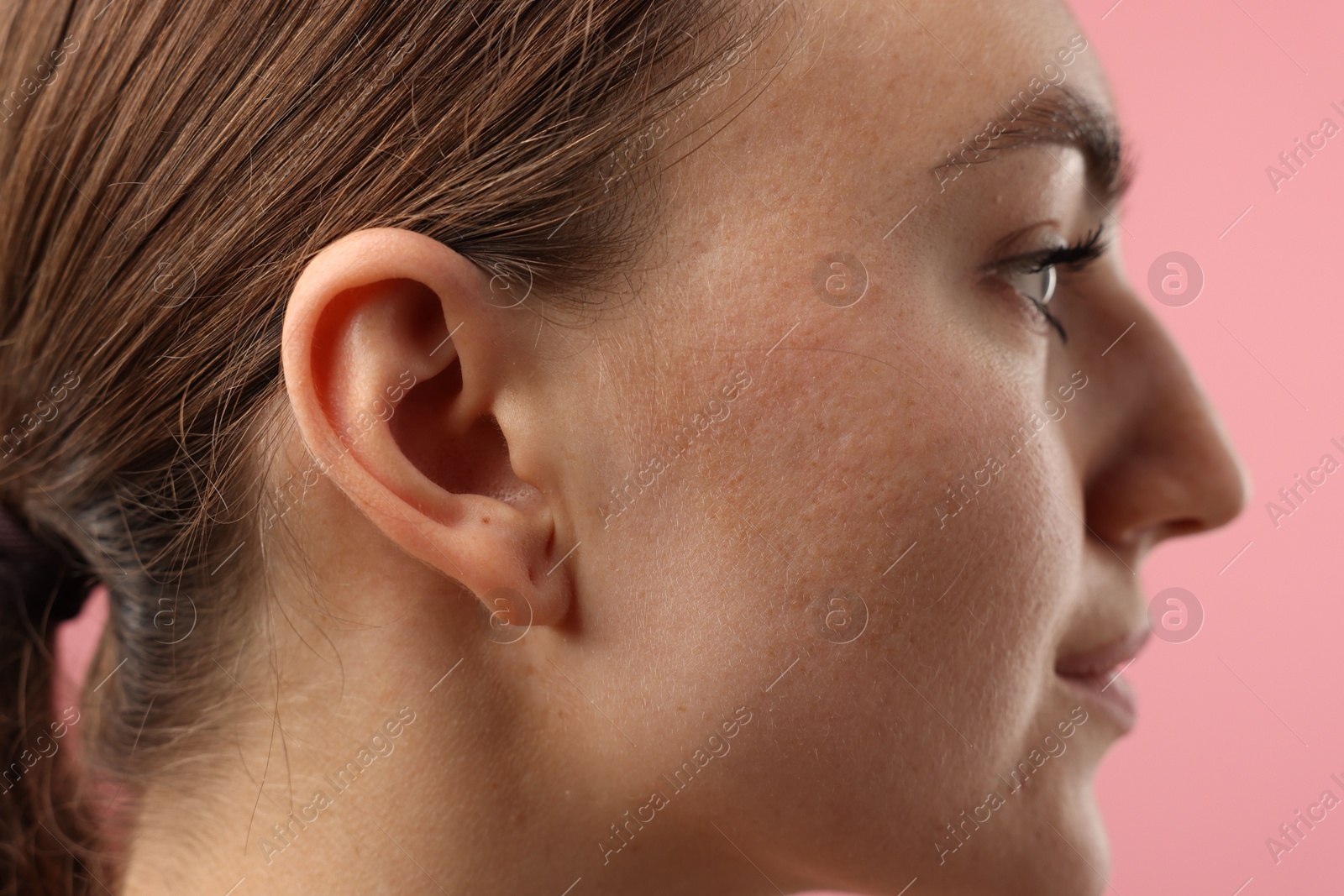 Photo of Sound. Woman on pink background, closeup view
