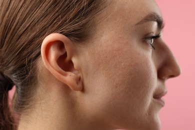 Photo of Sound. Woman on pink background, closeup view
