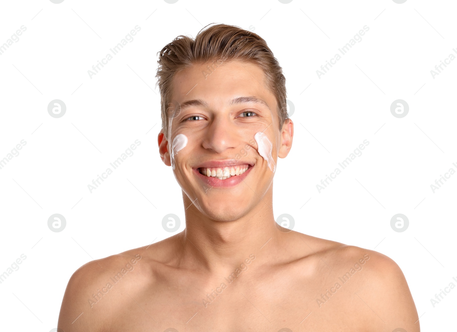 Photo of Handsome young man with cream on his face against white background