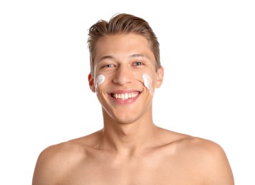 Photo of Handsome young man with cream on his face against white background