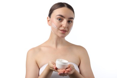 Photo of Beautiful woman with jar of face cream on white background