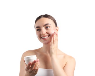 Photo of Beautiful woman applying cream onto her face on white background