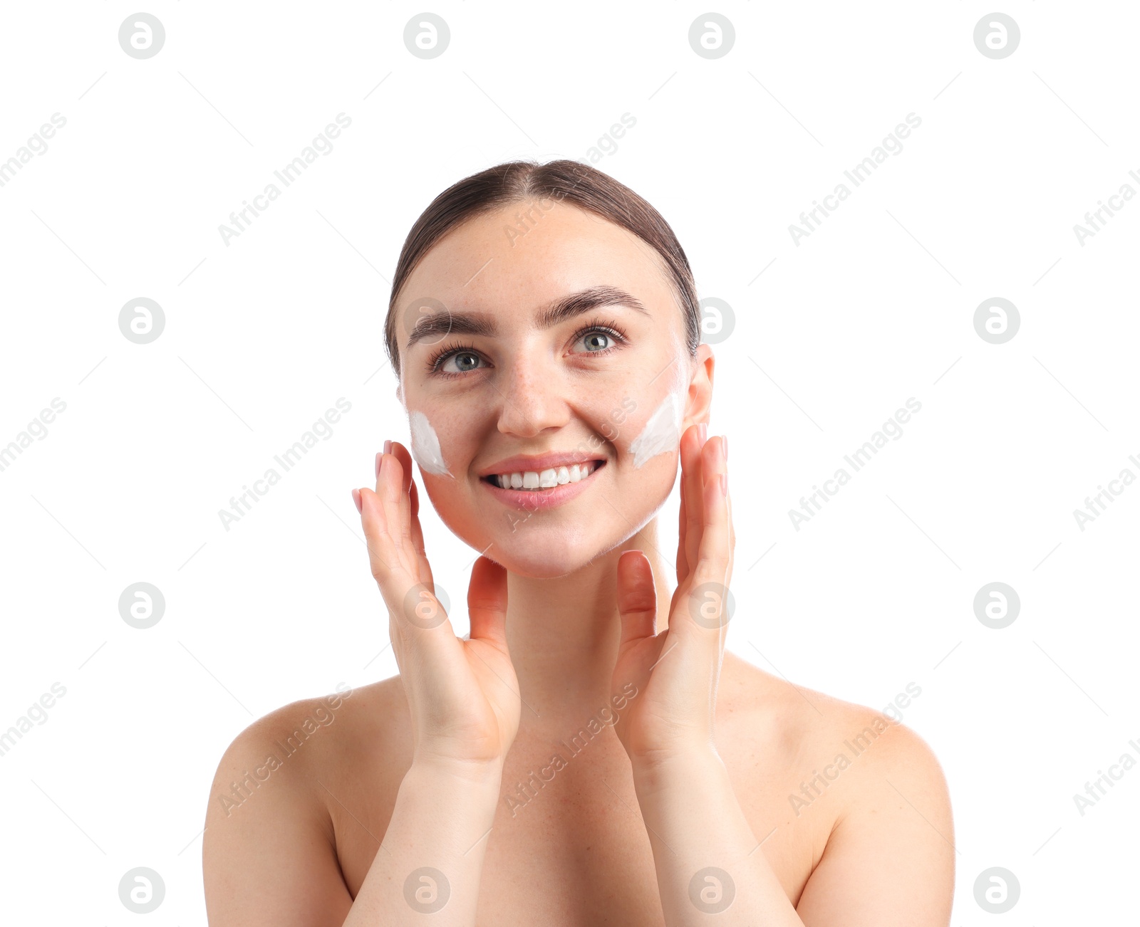 Photo of Beautiful woman with cream on her face against white background