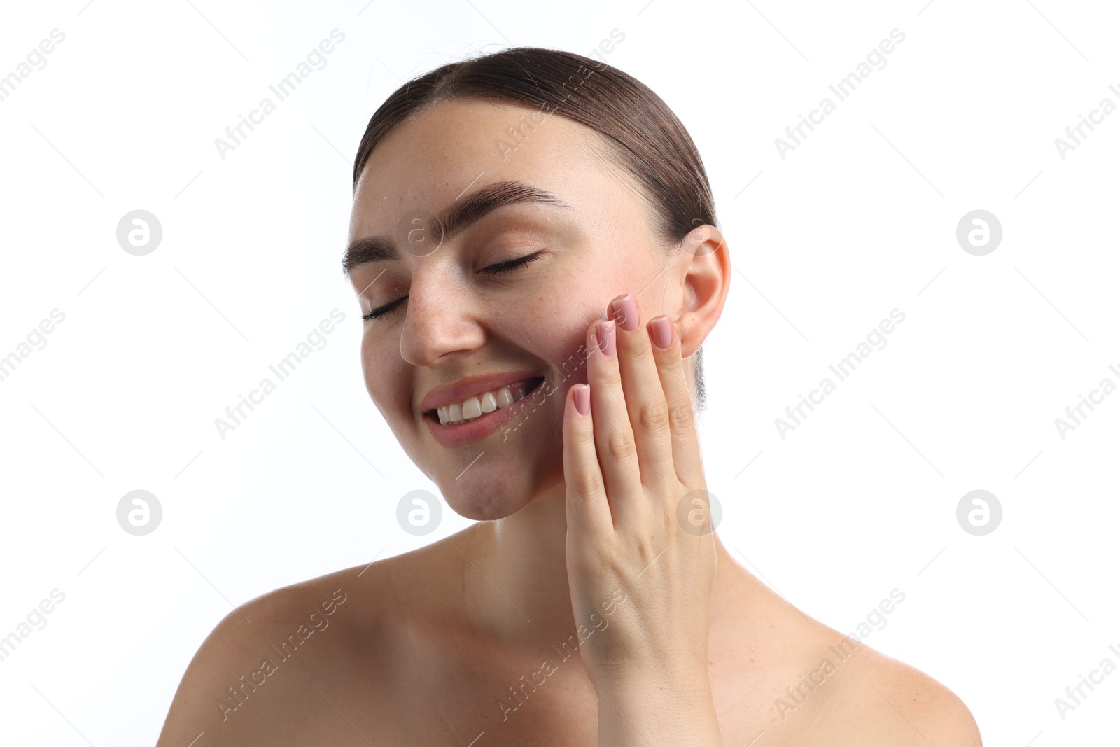 Photo of Beautiful woman applying cream onto her face on white background