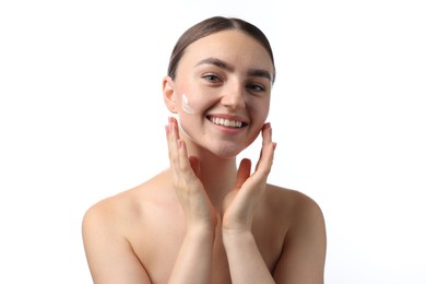 Photo of Beautiful woman with cream on her face against white background