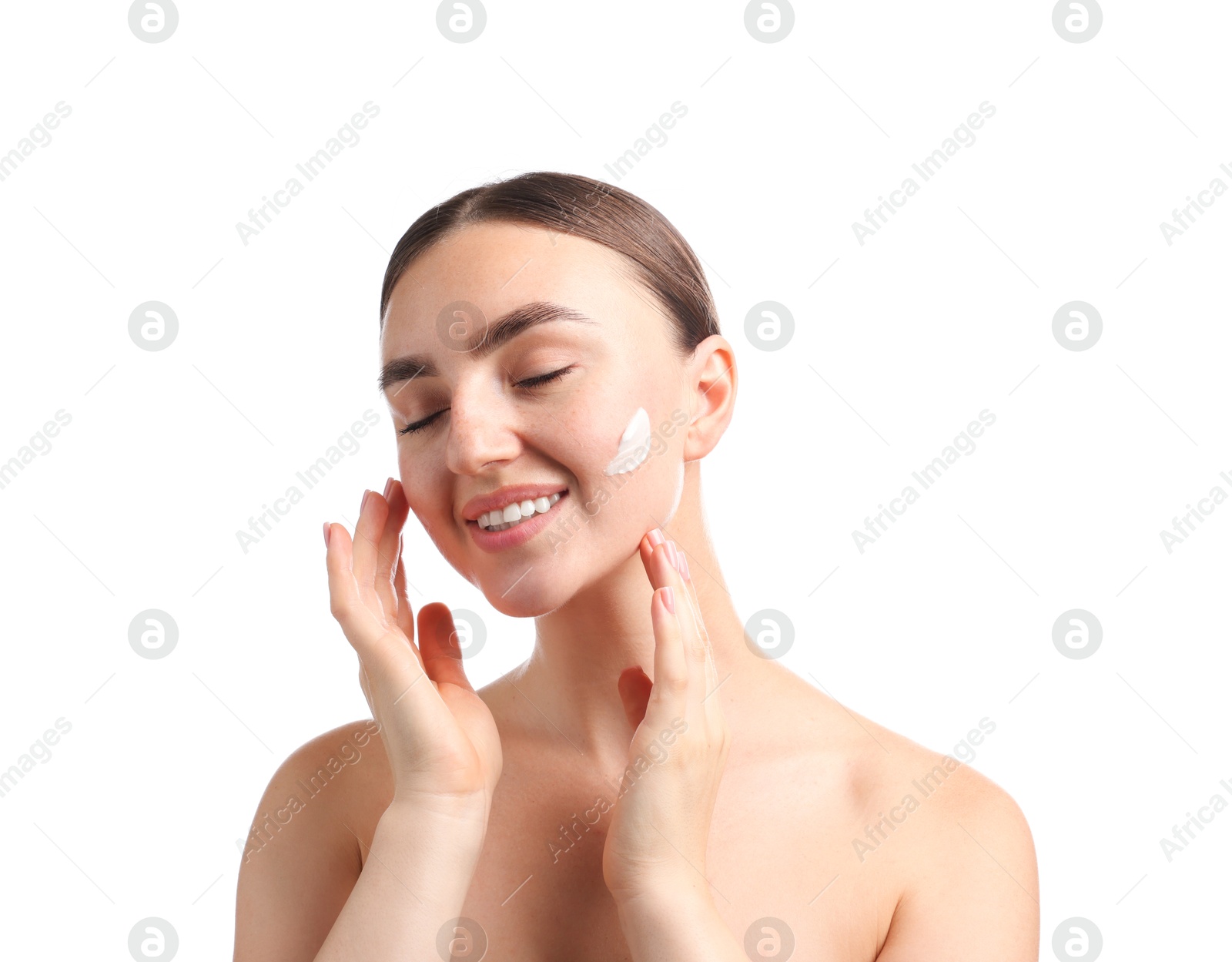 Photo of Beautiful woman with cream on her face against white background