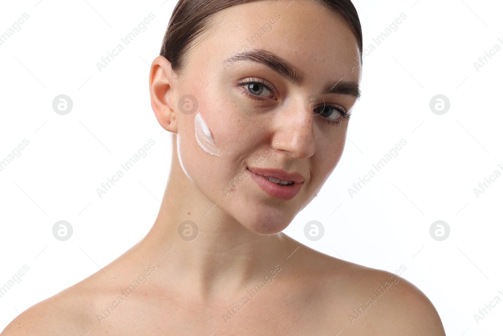 Beautiful woman with cream on her face against white background, closeup Photo of Beautiful woman with cream on her face against white background, closeup