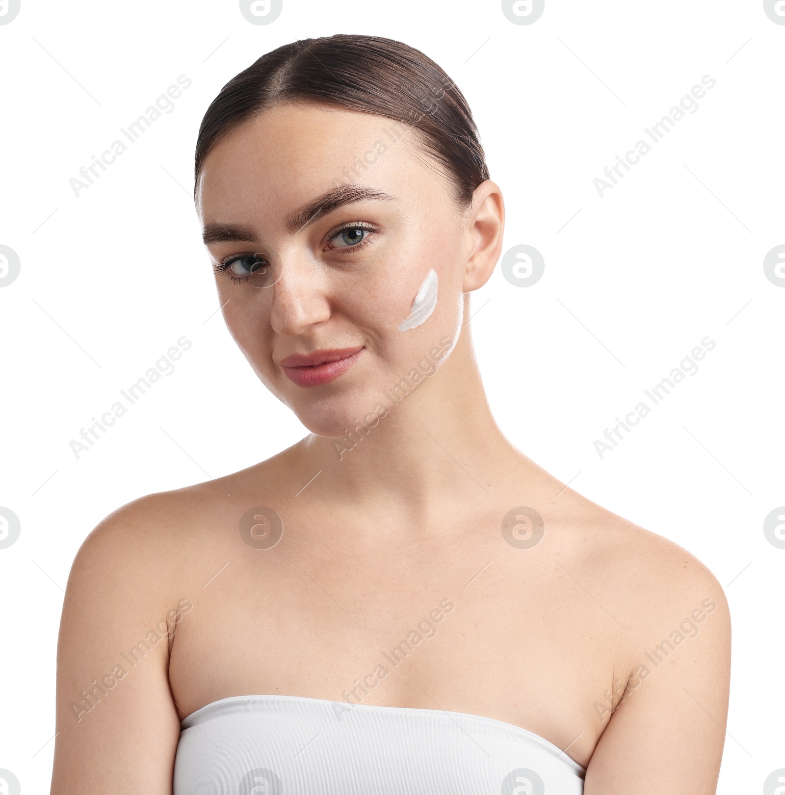 Photo of Beautiful woman with cream on her face against white background