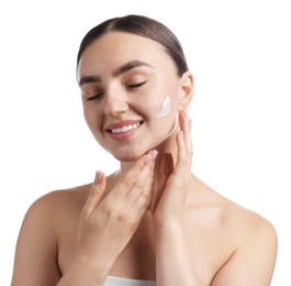Photo of Beautiful woman applying cream onto her face on white background