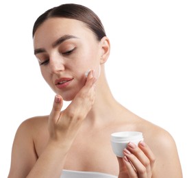 Photo of Beautiful woman applying cream onto her face on white background