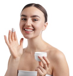 Photo of Beautiful woman with jar of face cream on white background