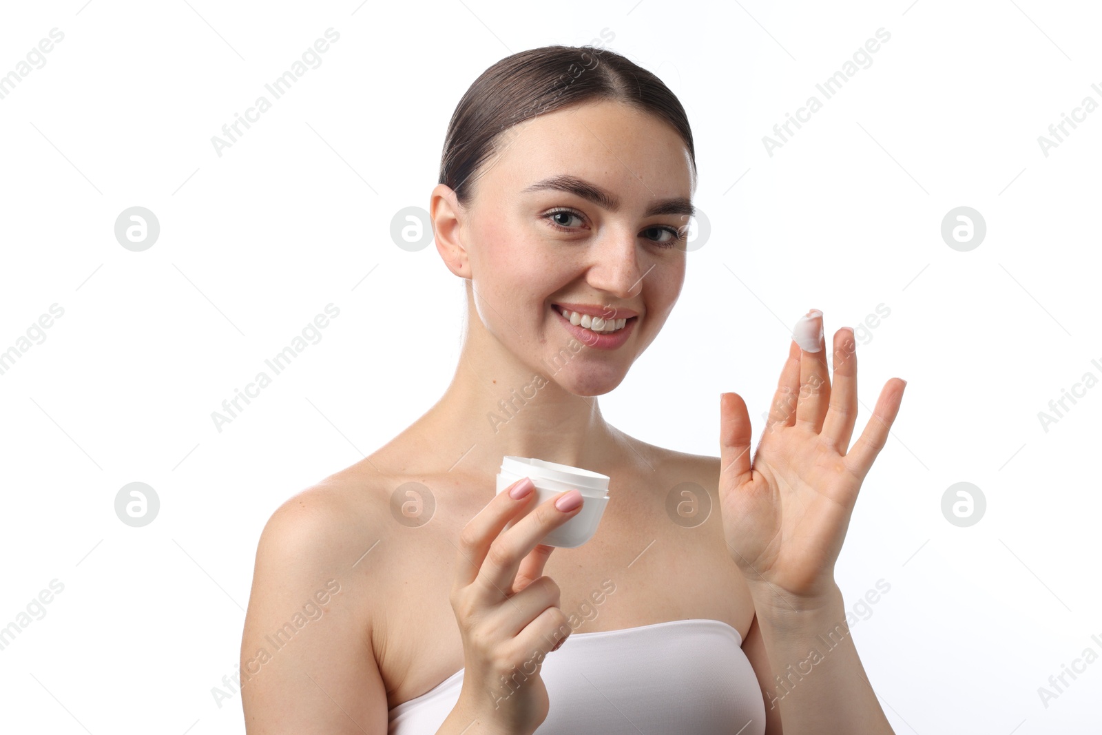 Photo of Beautiful woman with jar of face cream on white background
