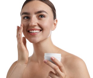 Photo of Beautiful woman applying cream onto her face on white background