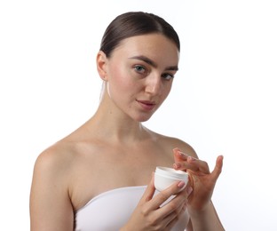 Photo of Beautiful woman with jar of face cream on white background