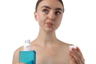 Photo of Woman rinsing mouth with mouthwash on white background. Oral hygiene