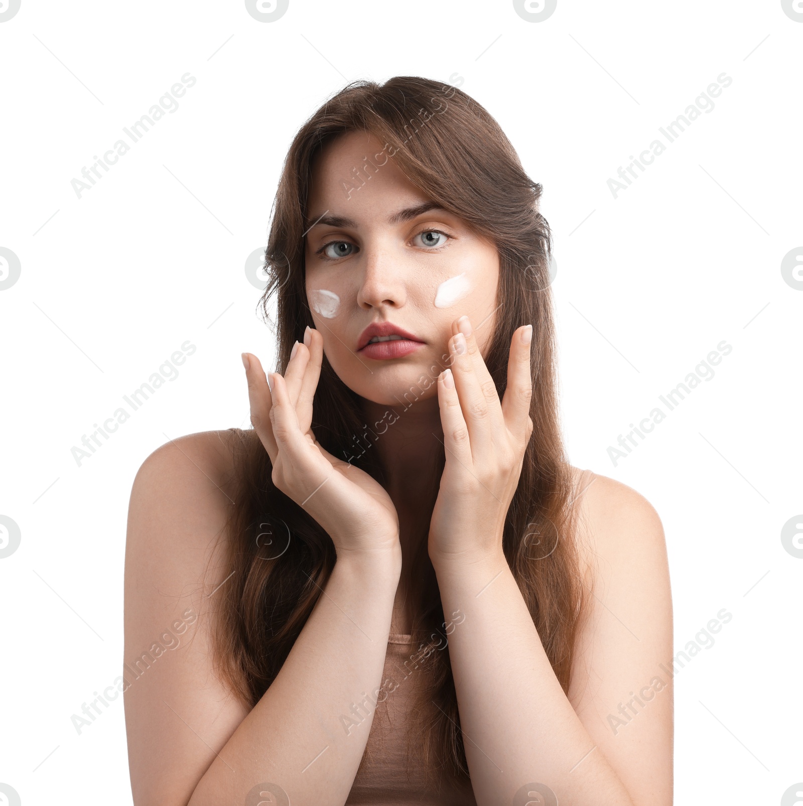 Photo of Beautiful woman with cream on her face against white background