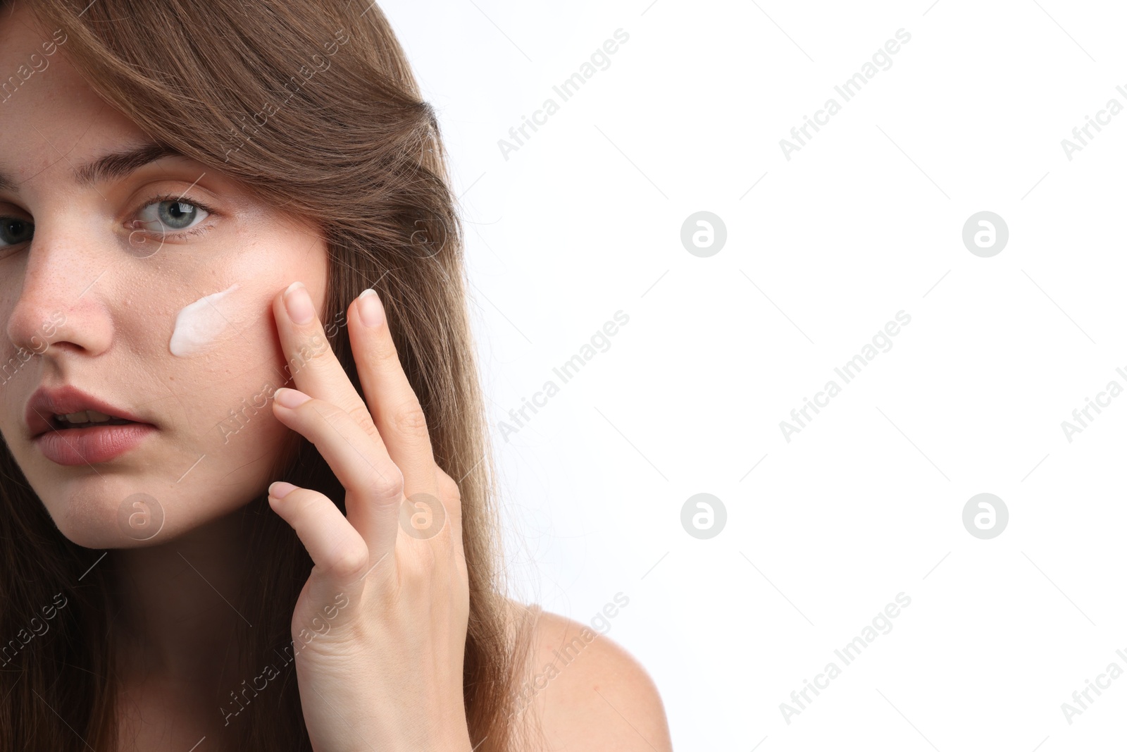 Beautiful woman with cream on her face against white background, closeup. Space for text Photo of Beautiful woman with cream on her face against white background, closeup. Space for text