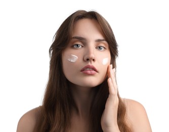 Photo of Beautiful woman with cream on her face against white background