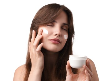 Photo of Beautiful woman applying cream onto her face on white background