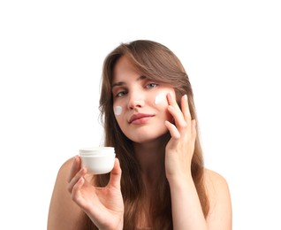 Photo of Beautiful woman applying cream onto her face on white background