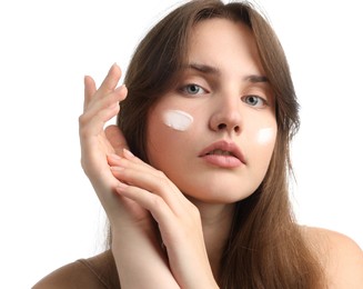 Photo of Beautiful woman with cream on her face against white background, closeup