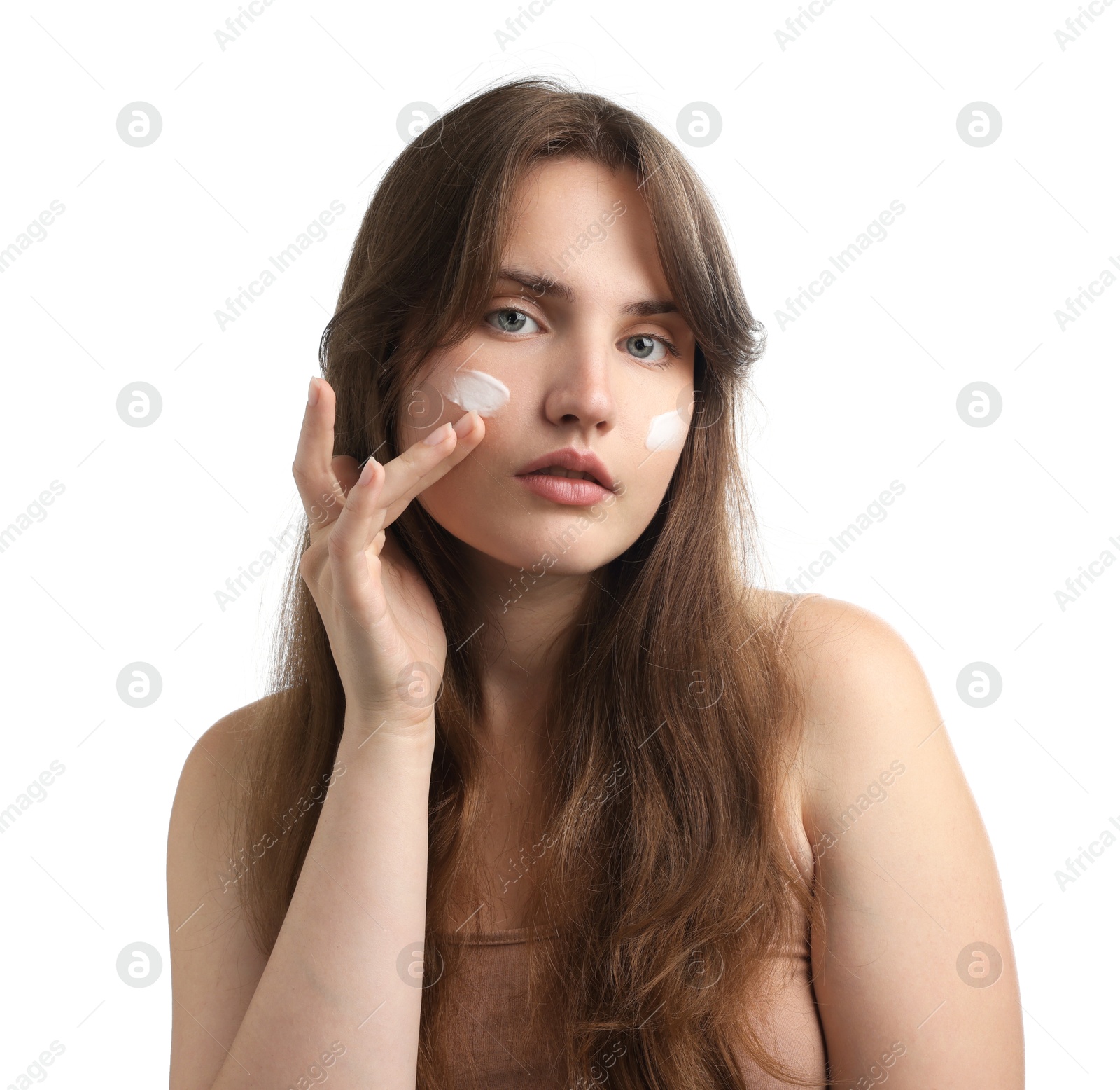 Photo of Beautiful woman with cream on her face against white background
