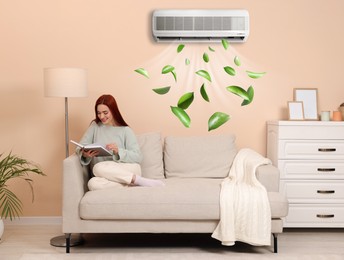 Image of Happy woman reading book at home. Air conditioner keeping comfortable temperature in room