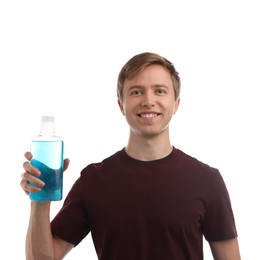 Photo of Man with bottle of mouthwash on white background. Oral hygiene