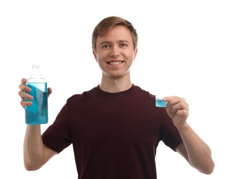 Photo of Man with mouthwash on white background. Oral hygiene