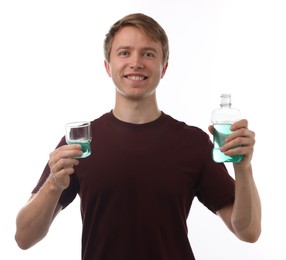 Photo of Man with mouthwash on white background. Oral hygiene
