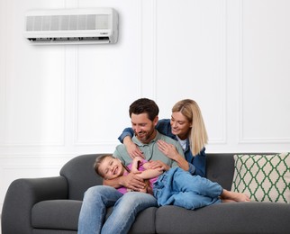 Image of Happy family having fun together at home. Air conditioner keeping comfortable temperature in room