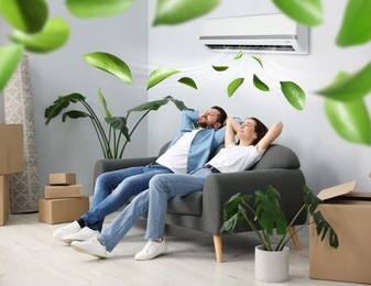 Image of Happy couple resting on couch at home. Air conditioner keeping comfortable temperature in room